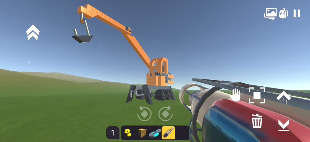 A player builds a large orange crane using blocks and wheels in Evertech Sandbox