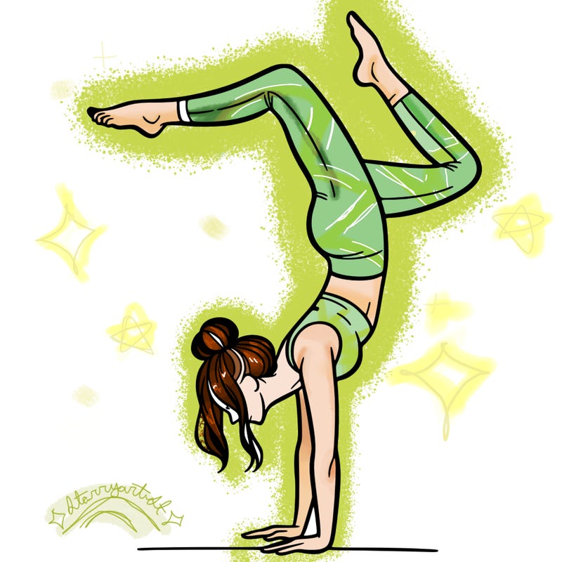 a woman doing a handstand