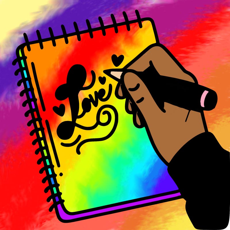 a hand writing “love” in calligraphy on a notebook