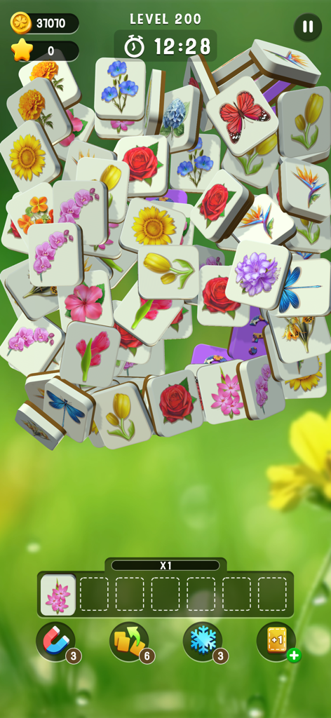 Blossom Match - Blossom Match gameplay screen showing stacked tiles with floral and nature illustrations