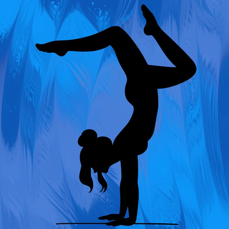 a woman doing a handstand