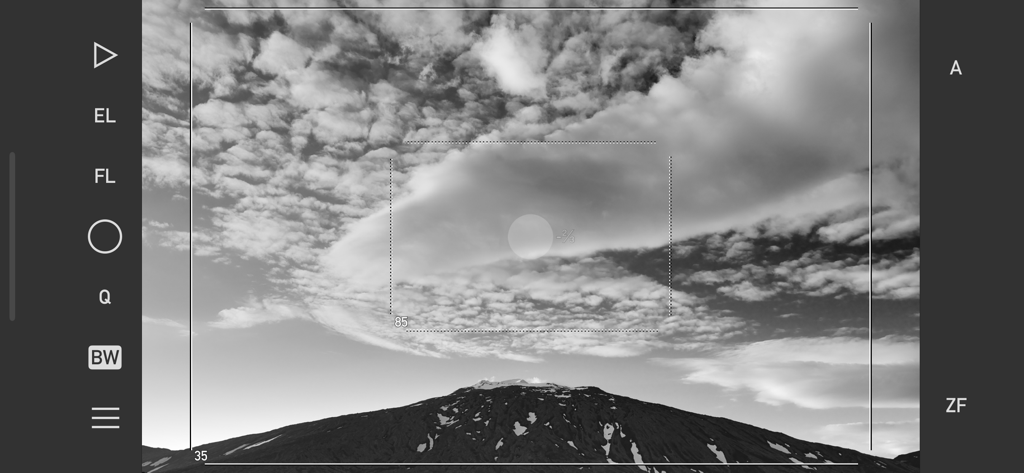 Mark II Artist's Viewfinder - Black and white view of a mountain landscape through the Mark II Artist's Viewfinder app interface showing framing lines and camera controls