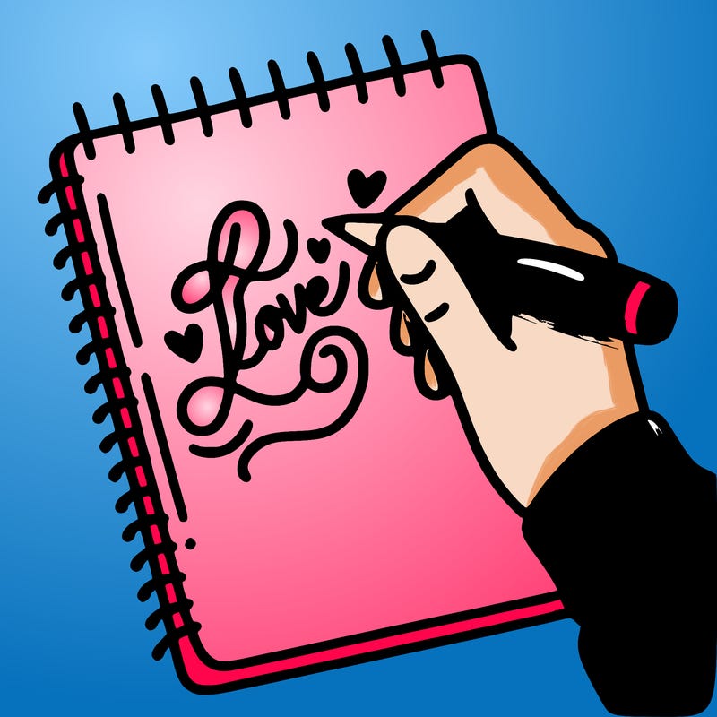 a hand writing “love” in calligraphy on a notebook