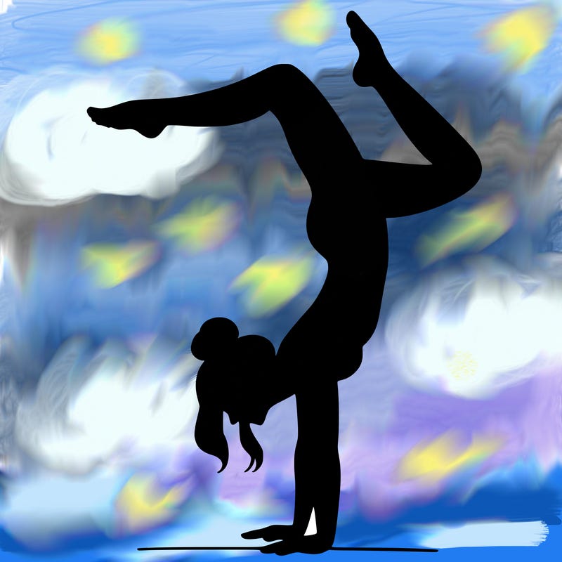 a woman doing a handstand