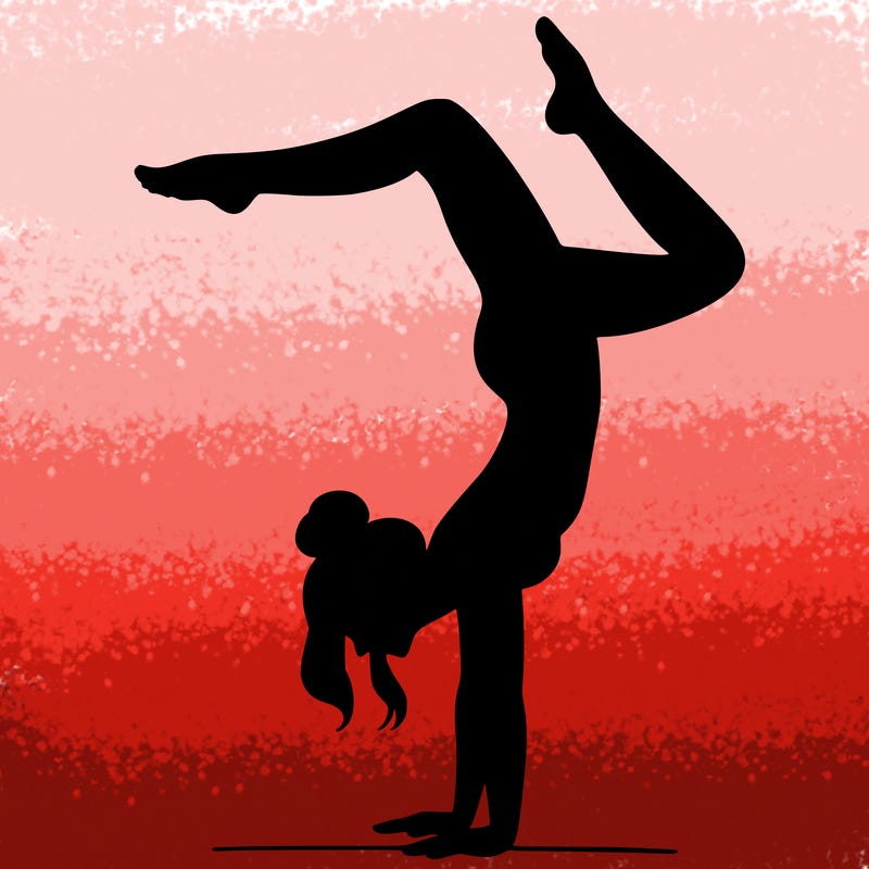 a woman doing a handstand