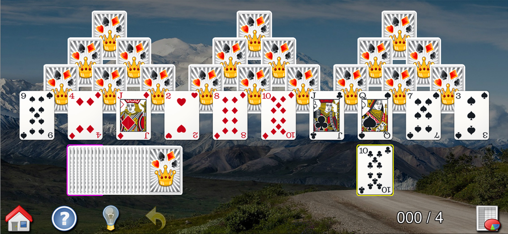Tri Peaks Solitaire game with mountain landscape background