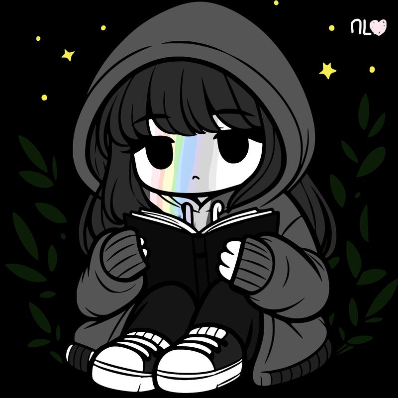 girl in oversized hoodie reading a book