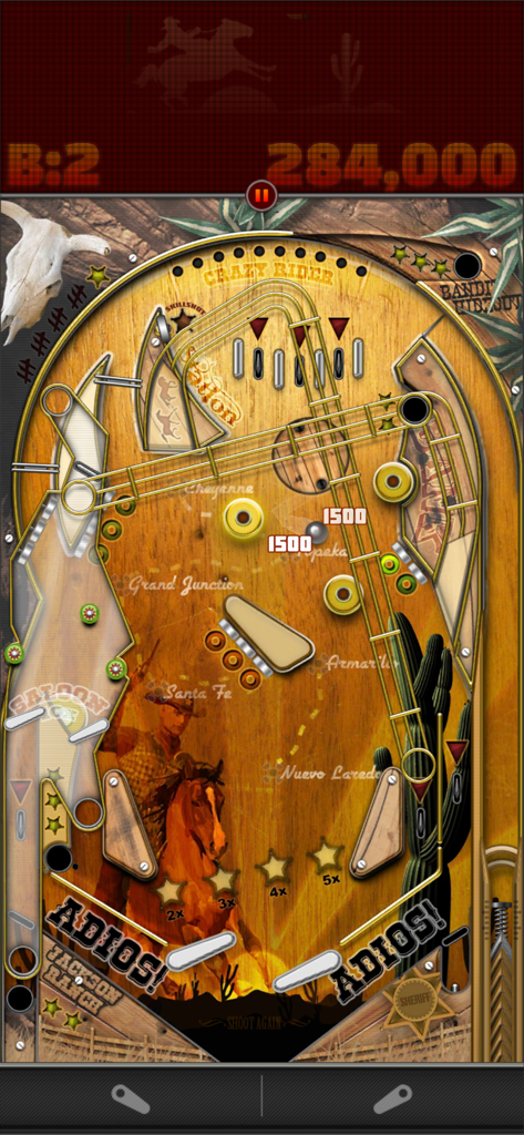 Wild West themed pinball table gameplay in Pinball Deluxe Reloaded showing a cowboy on a horse and score display