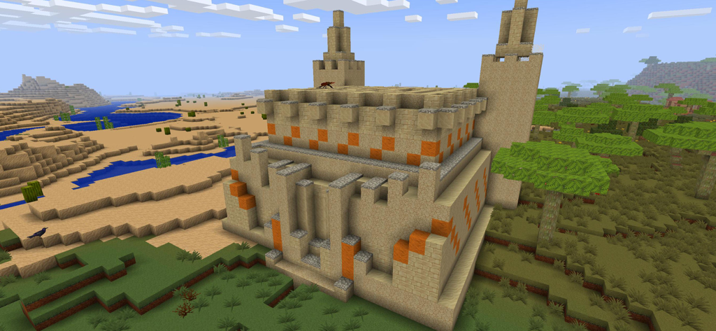 PrimalСraft 3D: Block Building - Una gran fortaleza de arenisca construida en un juego de construcción con bloques en 3D entre un desierto y un bosque