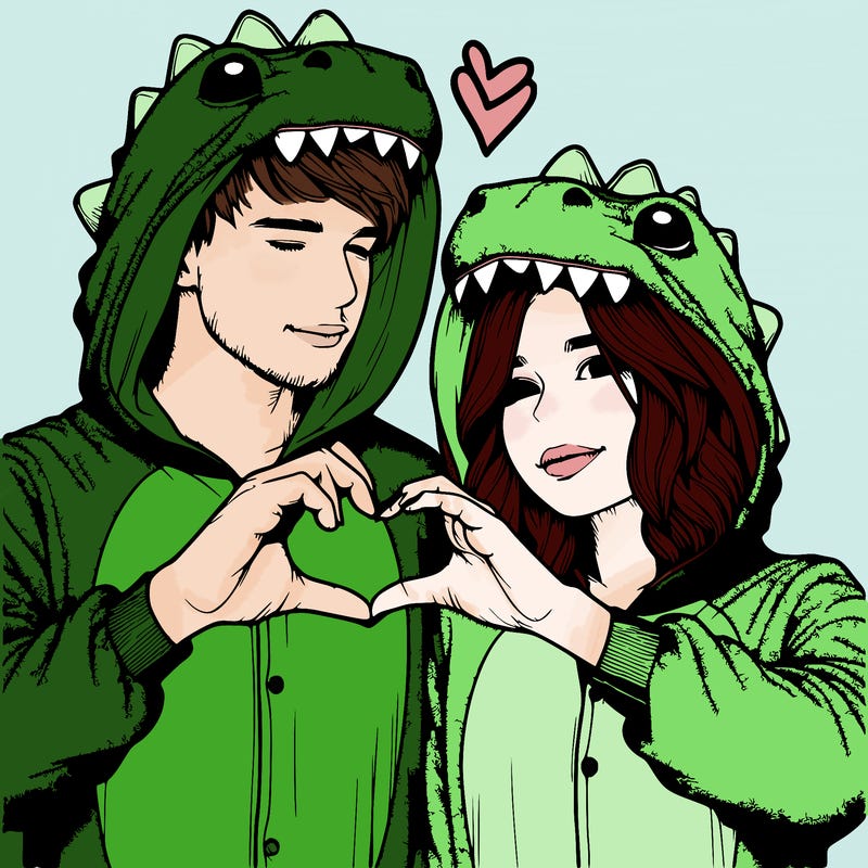 realistic couple wearing matching dinosaur onesies with heart hand gesture