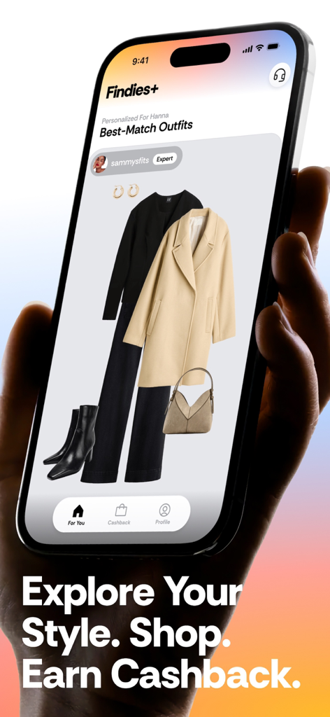 A hand holding a smartphone displaying the Findies app with a personalized expert outfit recommendation and a call to earn cashback.