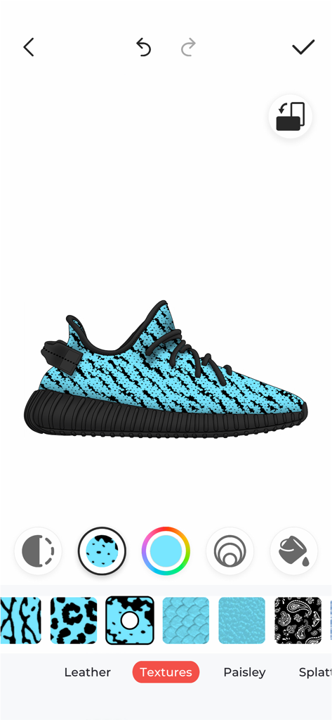 Custom Kicks - A user interface of the Custom Kicks app showing a blue and black patterned sneaker being designed with various textures and colors