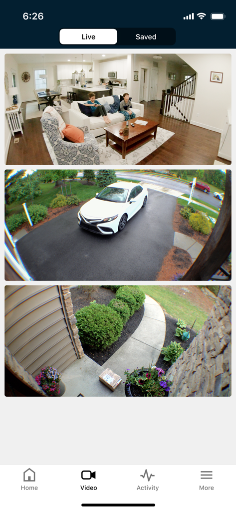 Securitas Connect app interface showing live video feeds of a living room, driveway, and front porch.