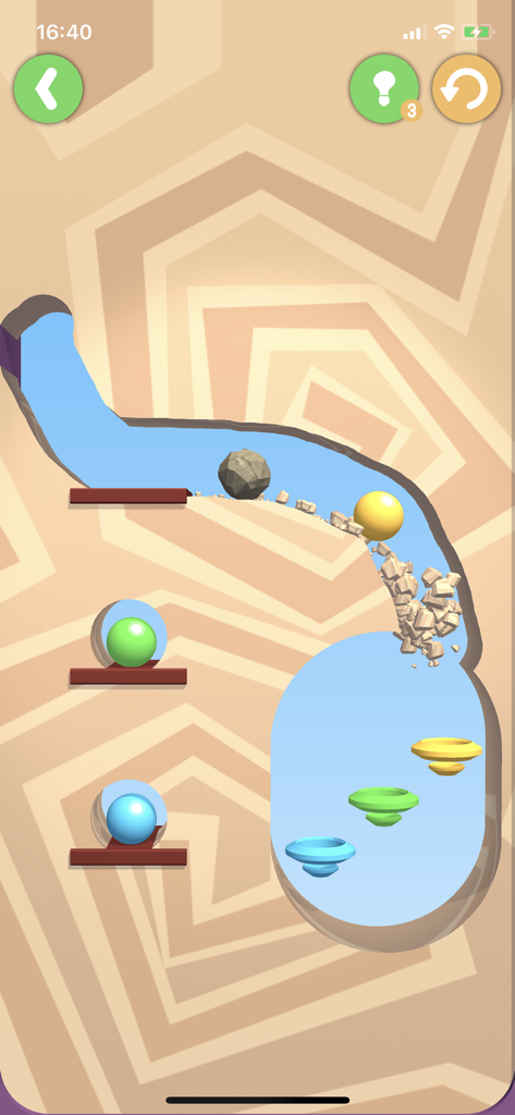 Dig This! - Dig Thisのゲームプレイ。ボールと岩が砂に掘られた道を通って色付きのゴールに向かう様子