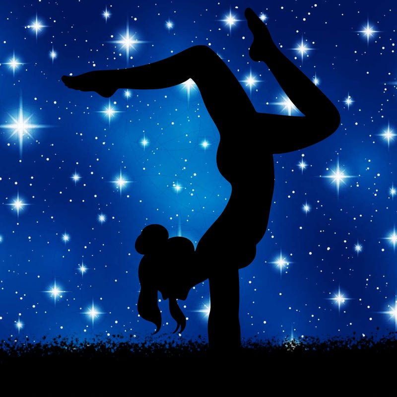 a woman doing a handstand