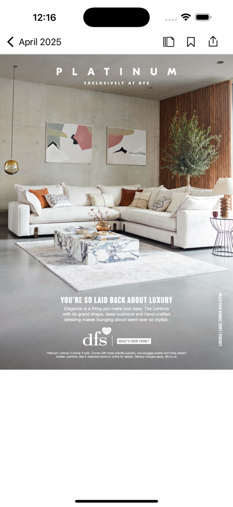Modern living room advertisement for a white DFS corner sofa and marble coffee table