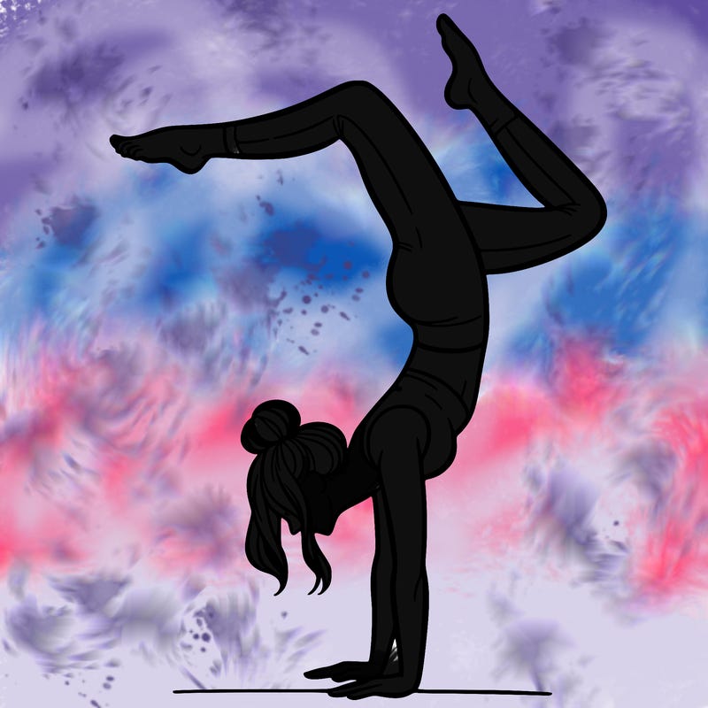 a woman doing a handstand