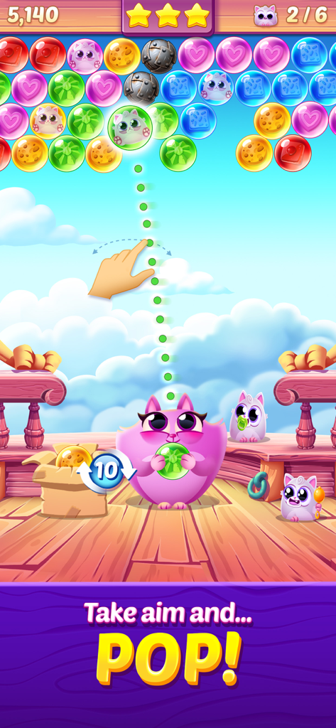 Cookie Cats Pop - A colorful bubble shooter level in Cookie Cats Pop where a cat character aims a bubble to rescue kittens