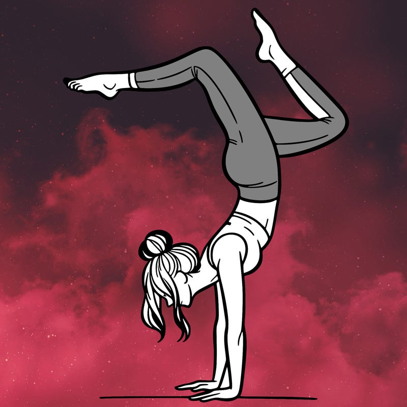 a woman doing a handstand