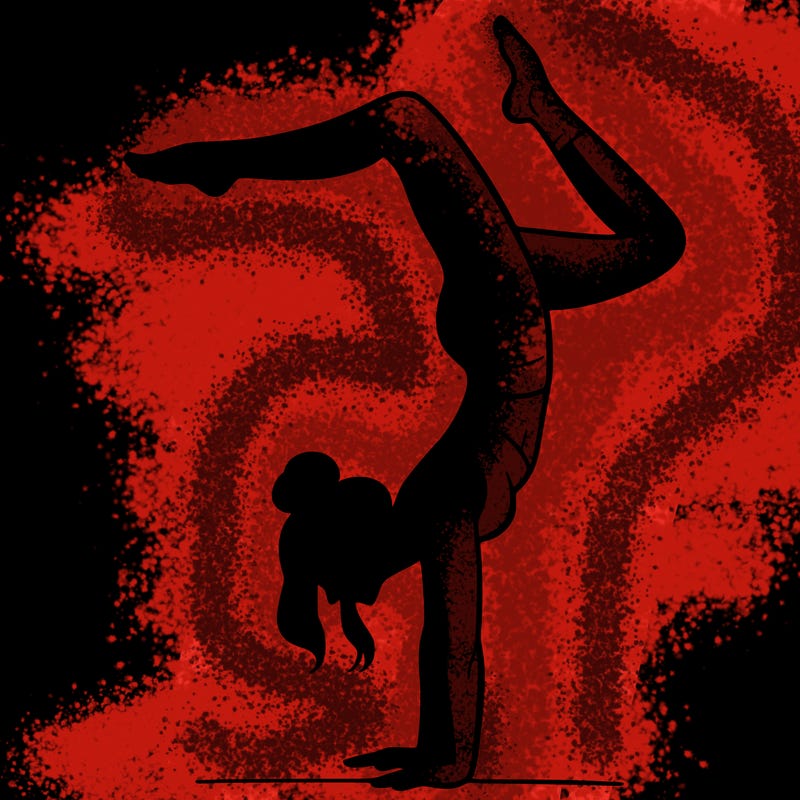 a woman doing a handstand