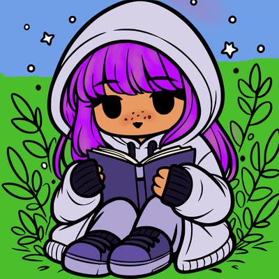 girl in oversized hoodie reading a book