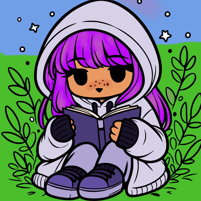 girl in oversized hoodie reading a book