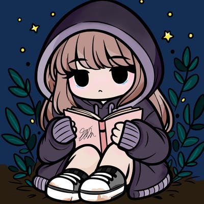 girl in oversized hoodie reading a book