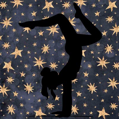 a woman doing a handstand