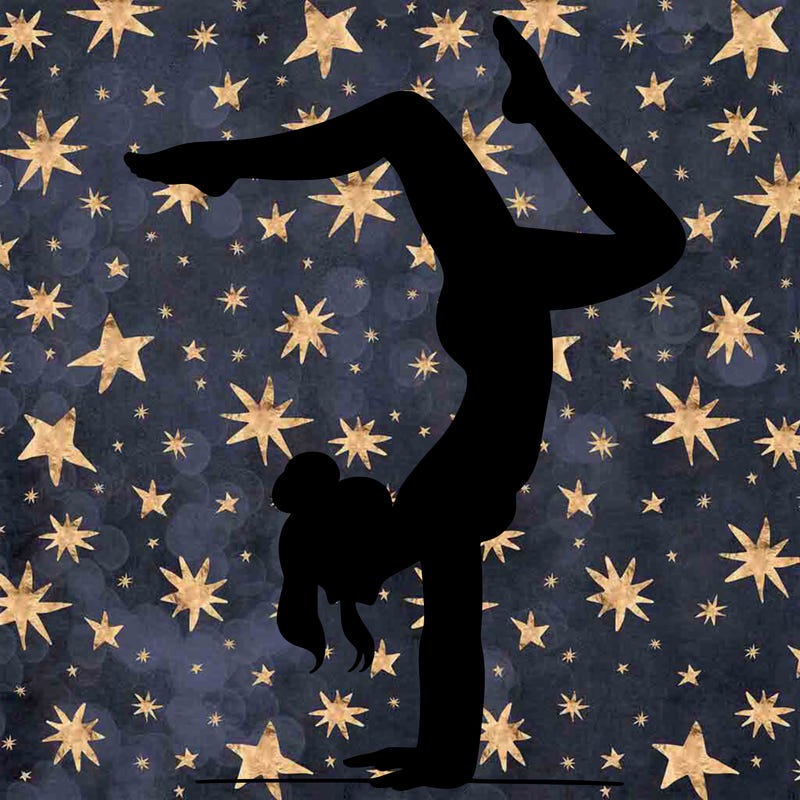 a woman doing a handstand