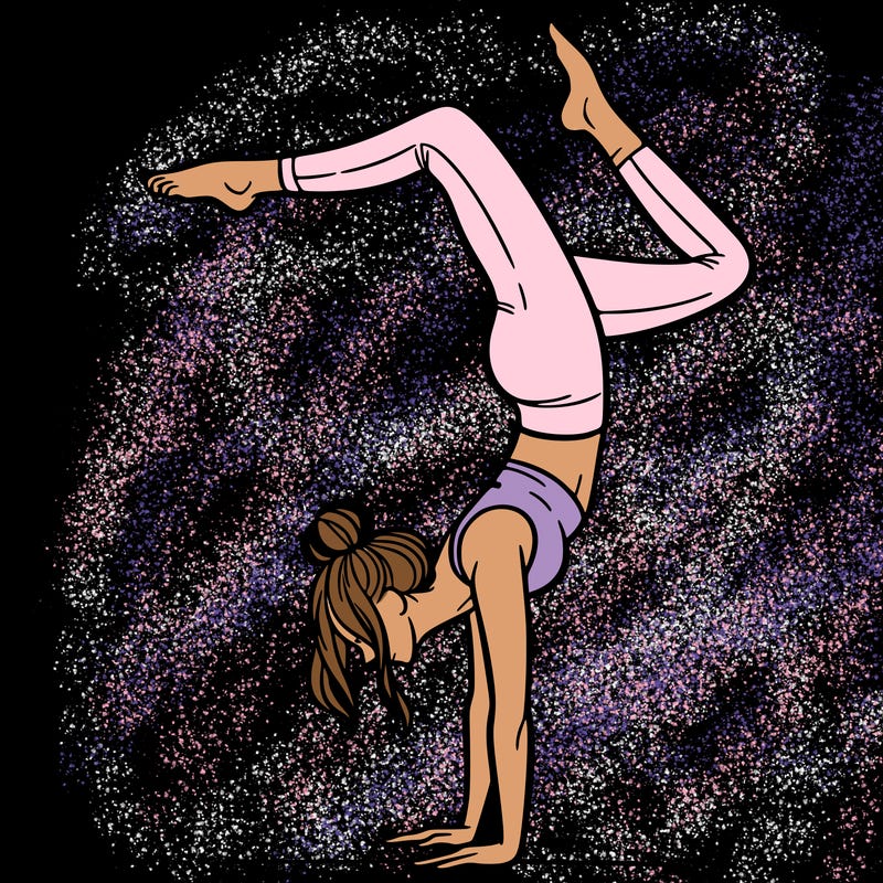 a woman doing a handstand