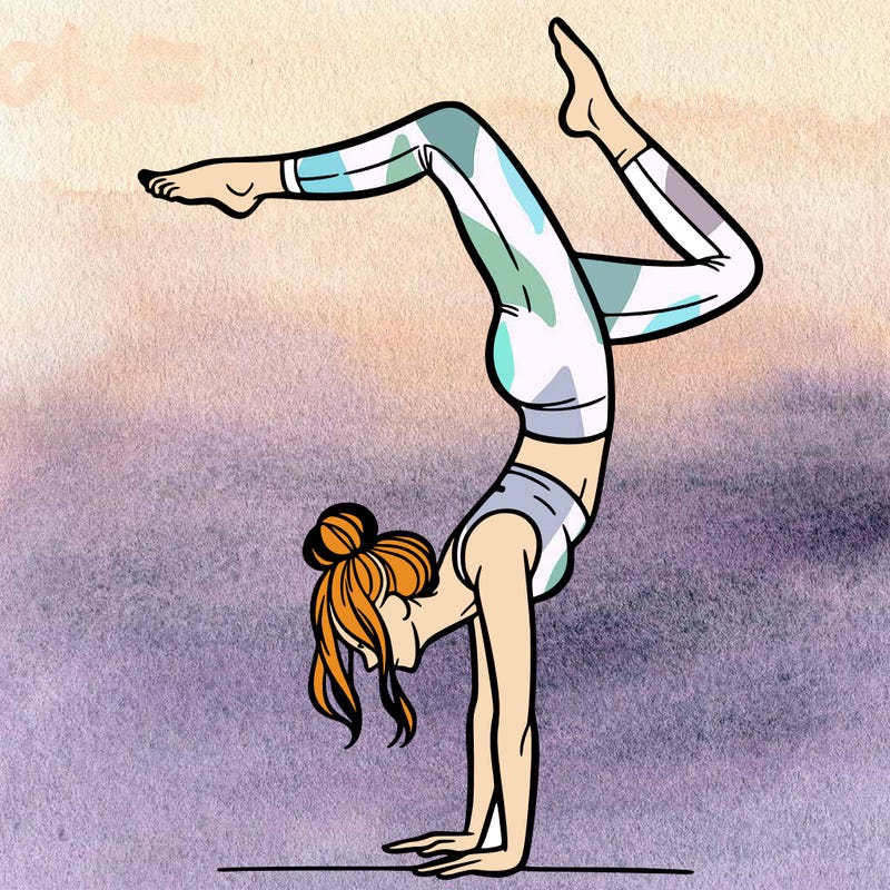 a woman doing a handstand