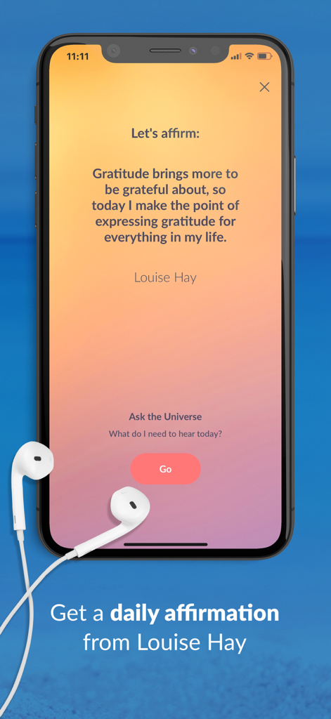 Empower You: Unlimited Audio - Smartphone screen showing a daily gratitude affirmation by Louise Hay in the Empower You app with white earbuds.