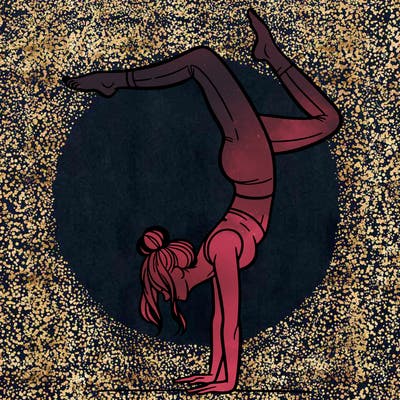 a woman doing a handstand