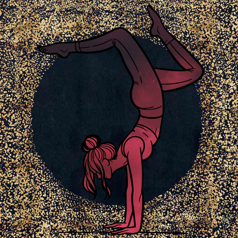 a woman doing a handstand