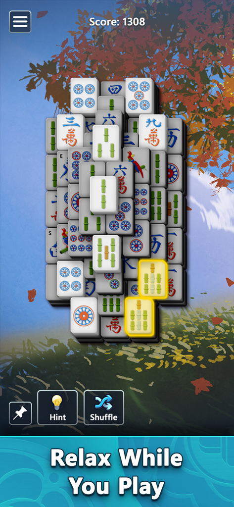 Mahjong by Microsoft gameplay showing matching tiles and a peaceful nature background
