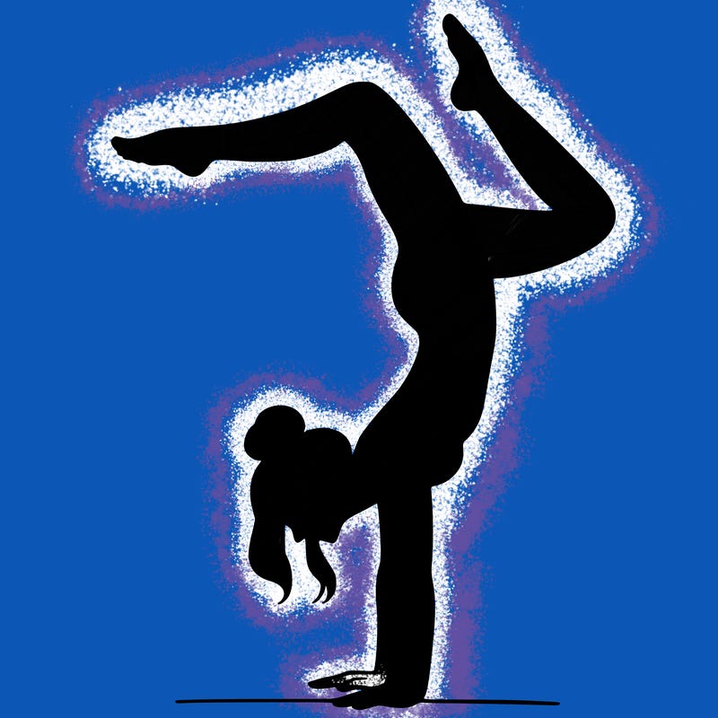 a woman doing a handstand