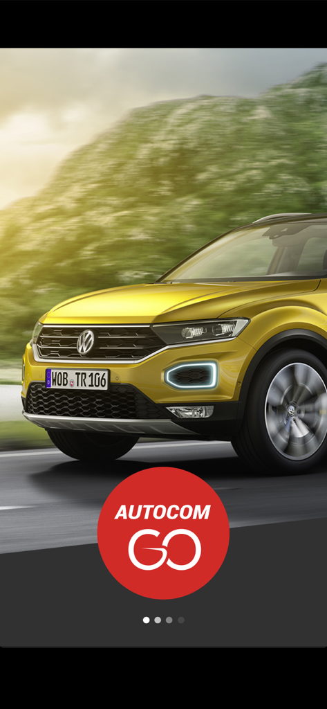 AUTOCOM GOのロゴが付いた、景色の良い道を走る黄色のSUV