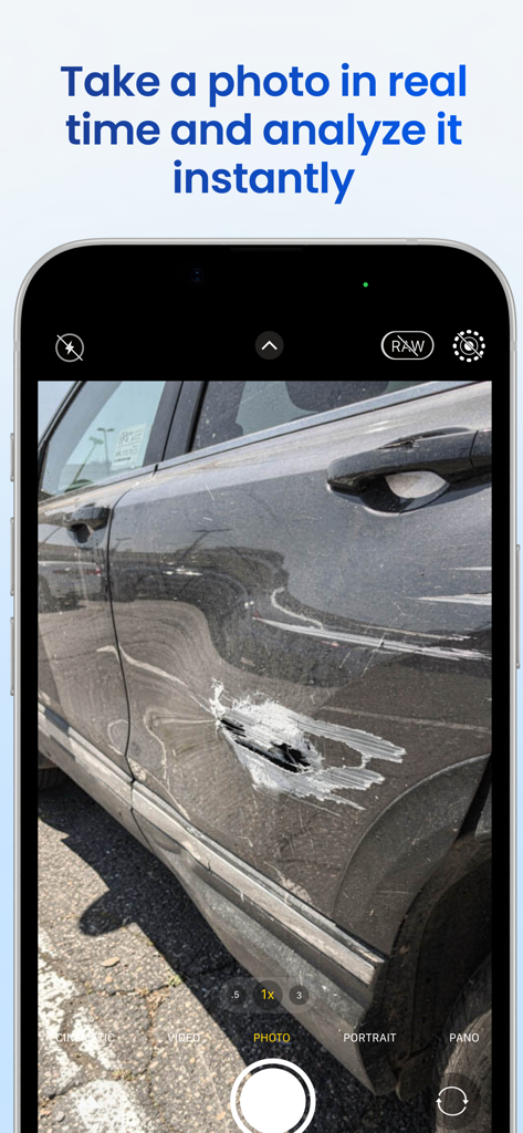 TruthScan app camera interface capturing a photo of a damaged car for instant AI detection.