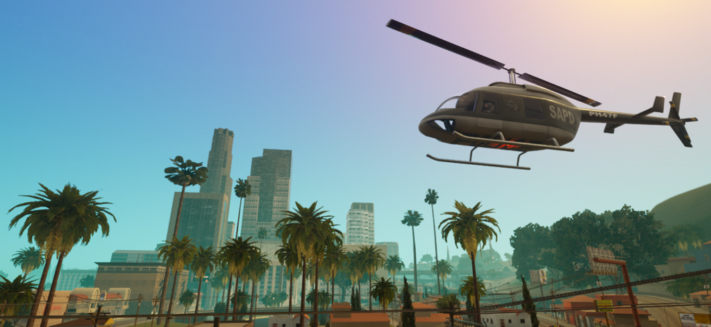 GTA: San Andreas – Definitive - A San Andreas Police Department helicopter flying over the Los Santos skyline with palm trees in the background.