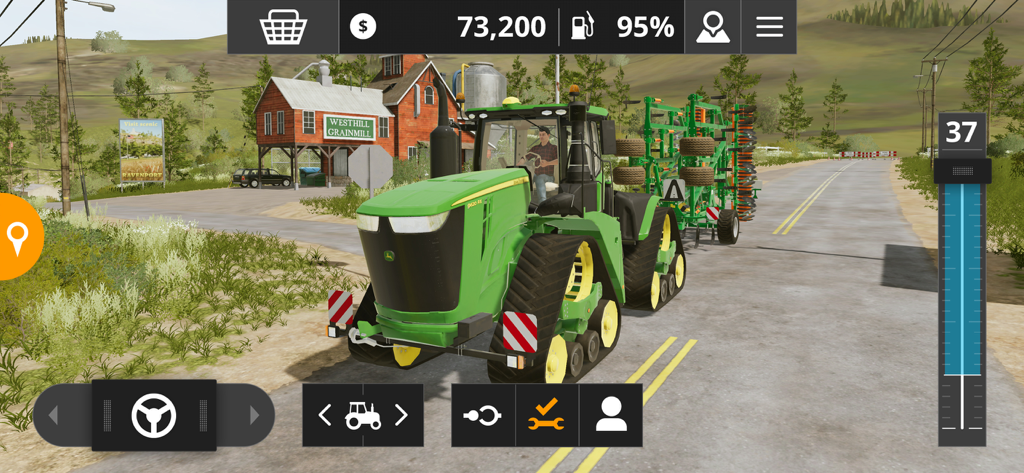 Farming Simulator 20 - A John Deere tractor driving past a grain mill on a rural road in Farming Simulator 20