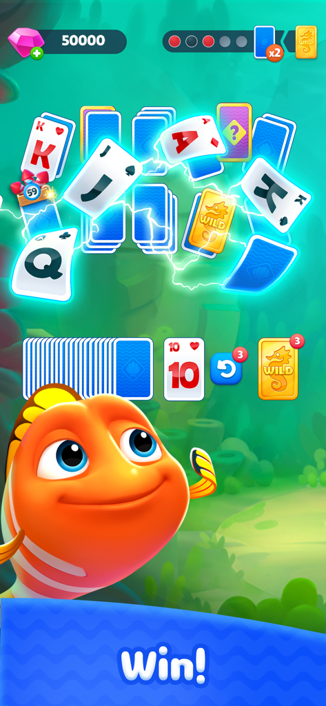 Fishdom Solitaire - Pantalla de victoria de Fishdom Solitaire con un pez naranja feliz y cartas de juego flotando.