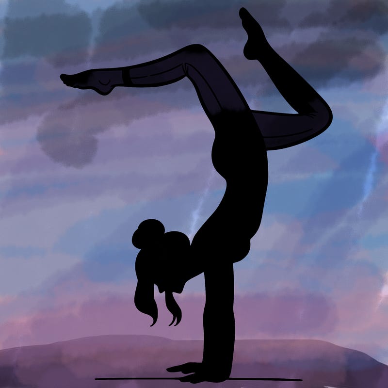 a woman doing a handstand