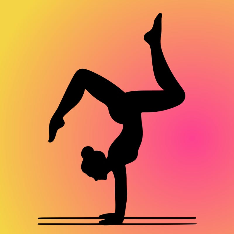 a woman doing a handstand
