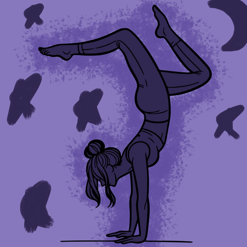 a woman doing a handstand