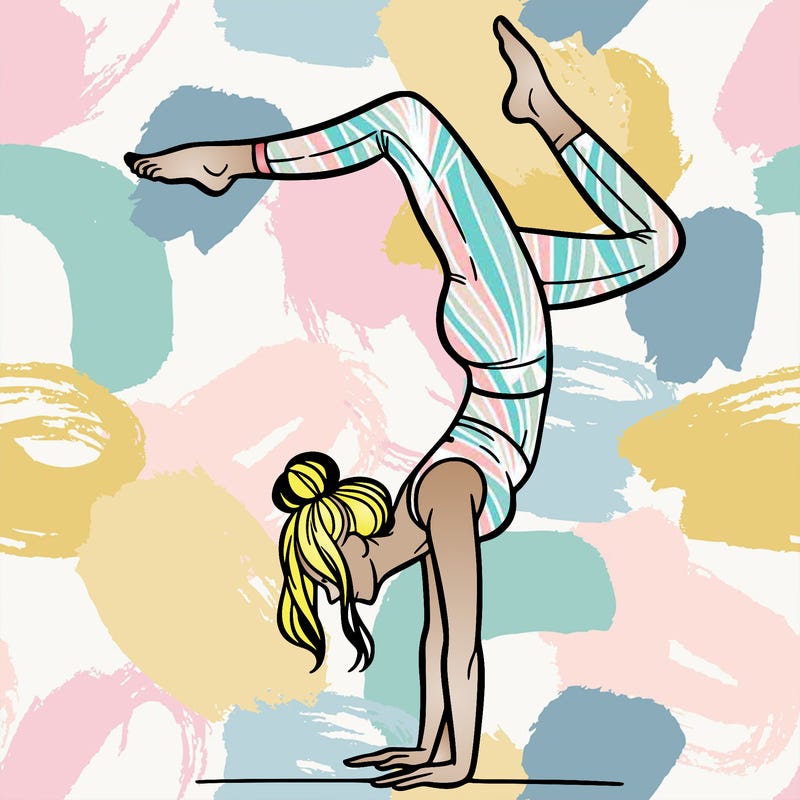 a woman doing a handstand