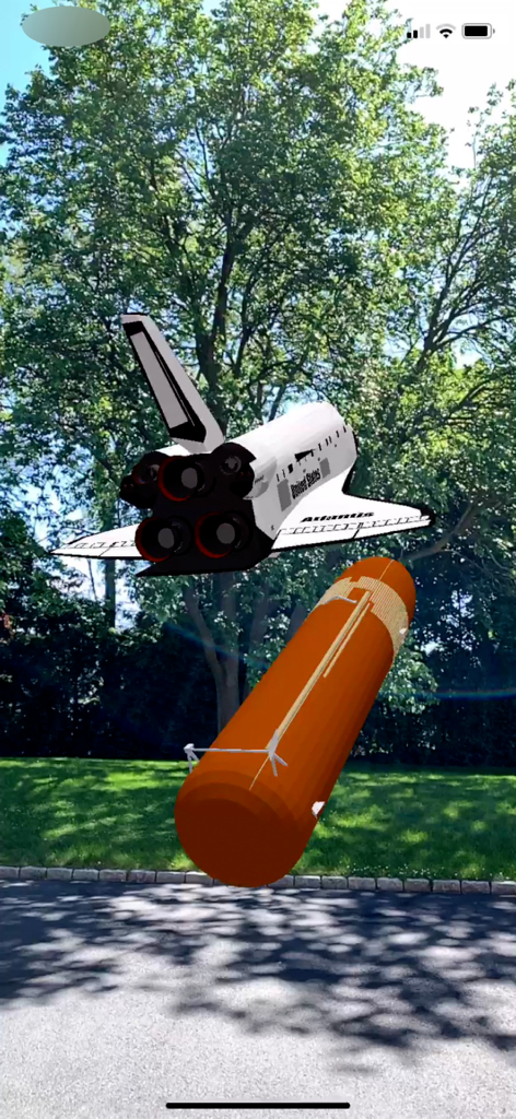 Space Shuttle AR - Augmented reality view of Space Shuttle Atlantis separating from its external fuel tank in a backyard