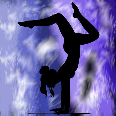 a woman doing a handstand