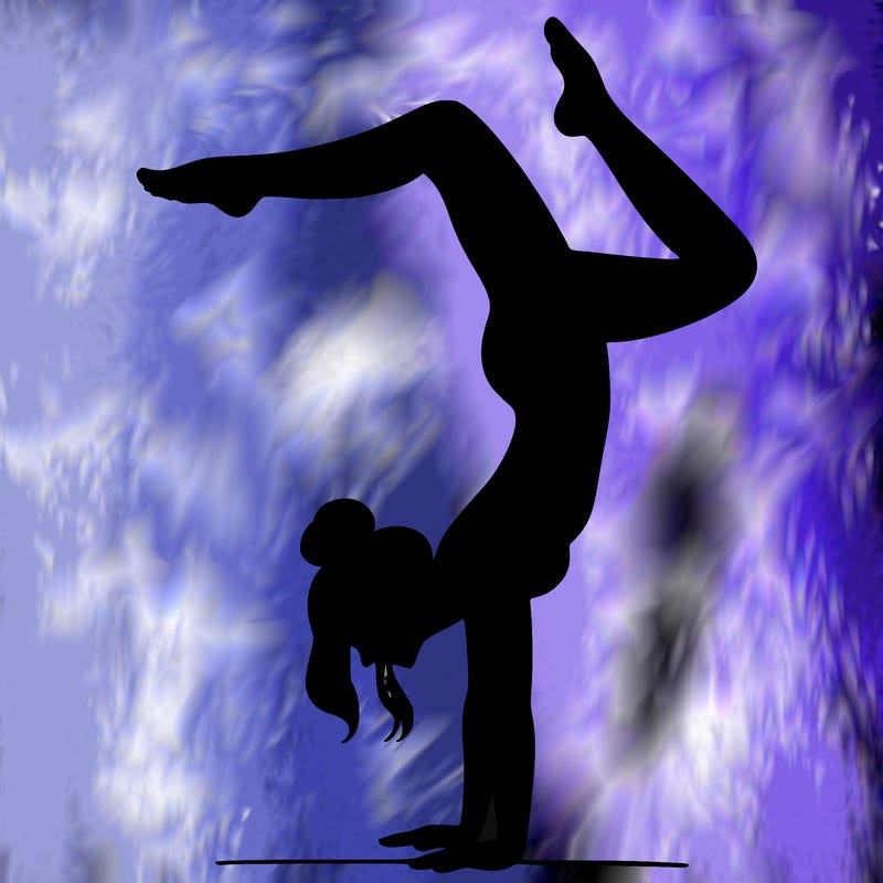 a woman doing a handstand
