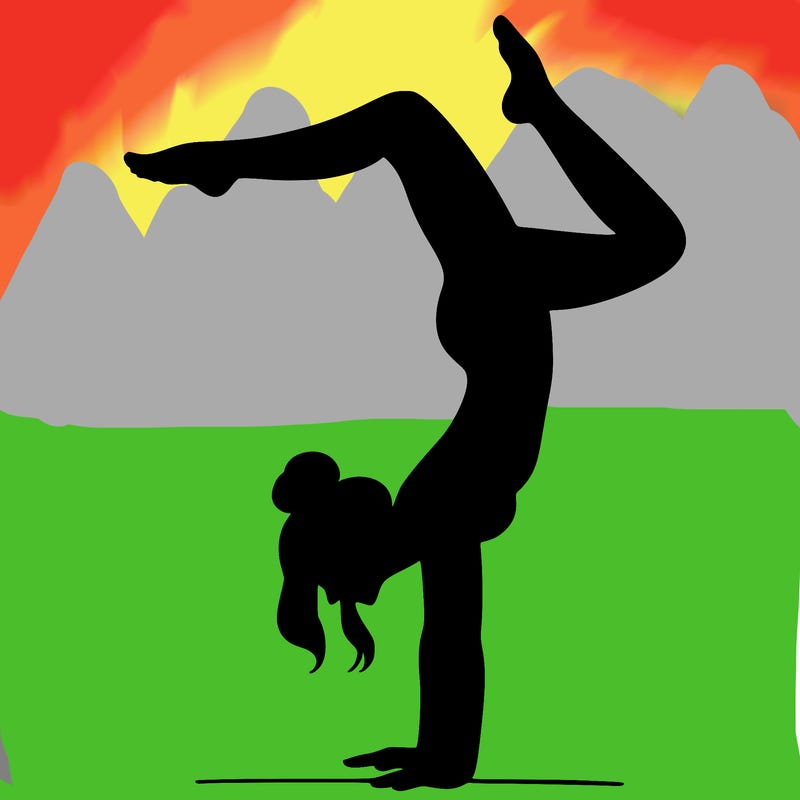 a woman doing a handstand