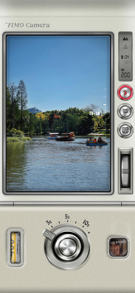 FIMO app skeuomorphic camera interface featuring a vintage viewfinder with a lake scene and tactile analog controls